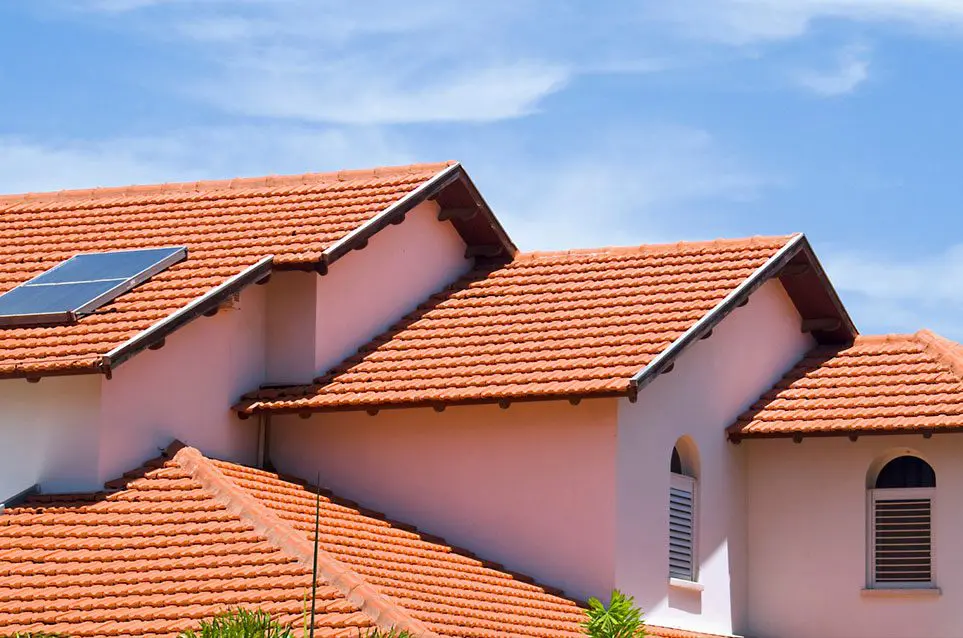 A close up of some red tile roofs